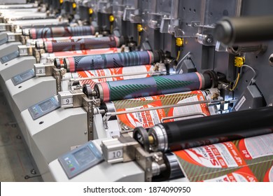 MINSK, BELARUS - JANUARY 2020: Rows of Large offset printing press. moving polymer label conveyor typography facility and flexographic printing