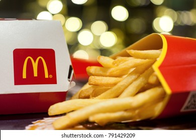 Minsk, Belarus, January 3, 2018: Big Mac Box with McDonald's logo and French fries in McDonald's Restaurant