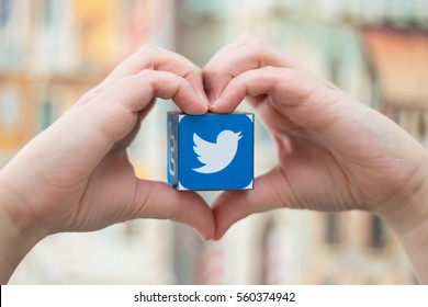 Minsk, Belarus - January 5, 2016: Twitter Blue Bird Logo On The  Teenager Hand. Heart. Background.