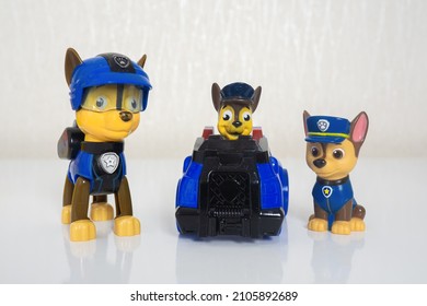 Minsk, Belarus - January 9, 2022: Paw Patrol Team. Different Miniatures Of Hero Chase With Blue Police Truck.