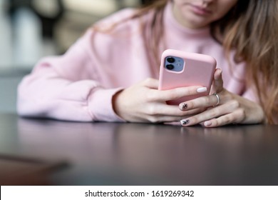 MINSK, BELARUS - JANYARY, 2020: Girl Using Iphone 11 In The Cafe