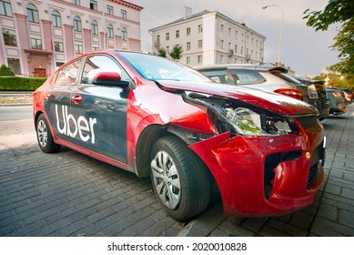 Minsk, Belarus - Jul 2021. Uber Taxi Car, Traffic Collision. Damaged Front Body Parts, Broken Headlight, Fender And Bumper Of Uber Taxi Car. Taxi Wrecked In Traffic Accident And Parked At City Street.