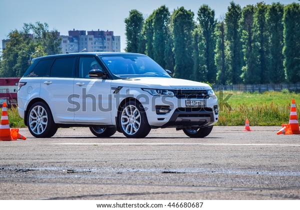 MINSK, BELARUS - JULY 1, 2016: Test-drive event\
for 2016 model year Land Rover and Range Rover is held in Minsk,\
Belarus on July 1, 2016. Black Range Rover and black Range Rover\
Sport are on display.