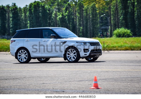 MINSK, BELARUS - JULY 1, 2016: Test-drive event\
for 2016 model year Land Rover and Range Rover is held in Minsk,\
Belarus on July 1, 2016. Black Range Rover and black Range Rover\
Sport are on display.