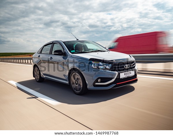 Minsk, Belarus - July 31, 2019: Lada Vesta Sport\
drives on a highway. Vesta Sport affordable russian car, it is\
designed using racing technology and adapted to daily trips in a\
city and on a highway.