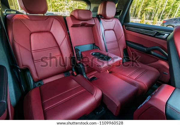 Minsk,\
Belarus - June 9, 2018: Photo of rear seats of two-tone Black and\
Bordeaux Red interior of Porsche Cayenne S 2018. The rear seats are\
comfortable and sporty, they can moved 160\
mm.