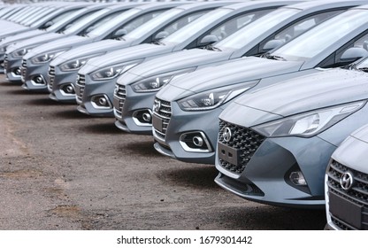 Minsk, Belarus. Mar 2020. Hyundai cars parked in row the parking lot of an authorized dealer. New cars on holding yard. Hyundai Accent vehicles on the parking in row. New cars for sale
