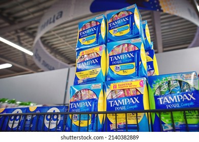 Minsk, Belarus. Mar 2022. Tampax tampons on sale. Tampax menstrual products on display on grocery store shelf in supermarket. Shelf with tampons or menstrual hygiene products, personal care products 