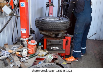 Minsk, Belarus - March 25, 2020: wheel repair at a car service center. Photo of a tire fitting job in a city.