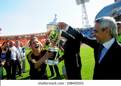 MINSK, BELARUS MAY 20: Nikita Bukatkin (FC NAFTAN captain) receives the trophy during final cup match between FC NAFTAN and FC MINSK on May 20, 2012 in Minsk, Belarus