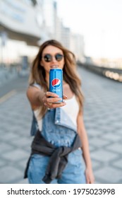 MINSK, BELARUS - MAY, 2021: Pretty Woman Holding Can Of Pepsi