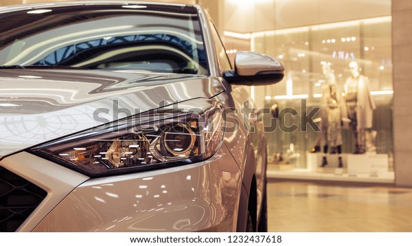 Minsk, Belarus. November,
2018. The new model of the popular Korean car Hyundai Tucson, IX
35.Headlight. The palletized car is exposed for sale in a huge
shopping center.