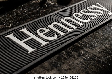 Minsk, Belarus - October, 2019 Hennessy Logo Printed On Rubber Drip Mat On Bar Counter, Selective Focus, Top View