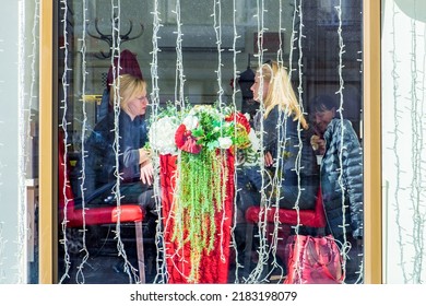 Minsk, Belarus - October 22, 2018: Two Middle-aged Women Outside The Window In A Cafe