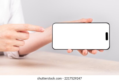 Minsk, Belarus October 23 2022 - Hands With Iphone 14 Phone Horizontal Screen Mockup. High Quality Photo