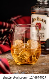 MINSK, BELARUS - OCTOBER 31, 2018: Bottle and glass Jim Beam is one of best selling brands of bourbon in the world, produced by Beam Inc. in Clermont, Kentucky