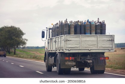 Minsk, Belarus. Sep 2021. MAZ Truck Carrying Gas Cylinders CO2, Transportation Of Dangerous Goods, Driving On Highway. Truck With Gas Cylinders On The Road. Transportation Of Hazardous Gas Cylinders