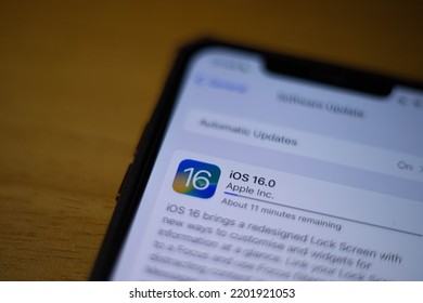 Minsk, Belarus, September 14, 2022. 
 IOS 16 Installation Displayed On Smartphone With Apple Logo In The Background