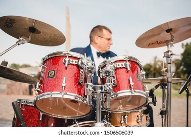 Minsk, Belarus - September 15, 2019: Orchestra Musician - Drummer In A Blue Suit Plays On An Outdoor Drum Kit - Jazz Music 