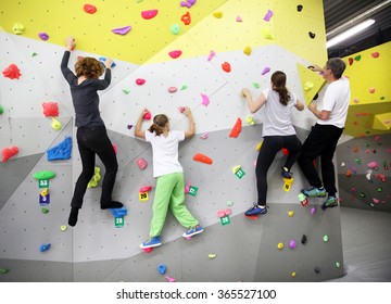 MINSK, BELARUS - SEPTEMBER 16, 2016: A Family Testing New Indoor Climbing Wall