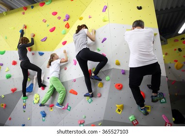 MINSK, BELARUS - SEPTEMBER 16, 2016: A Family Testing New Indoor Climbing Wall