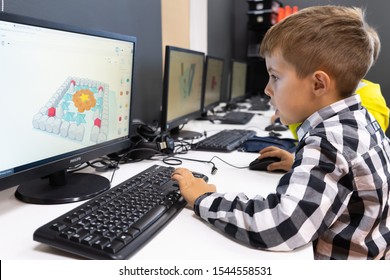Minsk, Belarus. September, 2019. Teenager boys are programming on Scratch. Computer. Scratch programme. STEM education. Coding. Teacher at school. Classes.