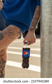 MINSK, BELARUS - SEPTEMBER, 2022: Woman Holding Bottle With Pepsi In The City