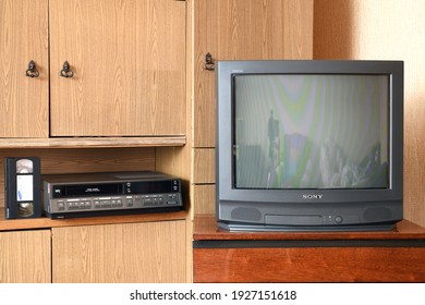 MINSK BELARUS-02.20.2021:An old black Sony trinitron kv-21m3 TV from the 1980s and 1990s and an old vintage Philips VR6460 video recorder from 1985.Design in a house in the style of the 1980s and 1990