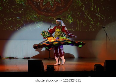 MINSK, REPUBLIC OF BELARUS - NOVEMBER 13, 2018: Concert "Kusturitsa show" gypsy band. Dance of the dervishes of tanura.
