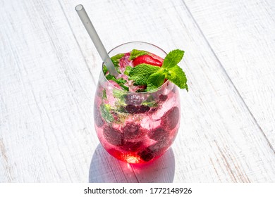  Mint And Berry On Top In Glass. Cold Summer Drink. Sparkling Glasses With Berry Cocktail.