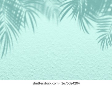 Mint Blue Cement Texture Wall Leaf Plant Shadow Background.Summer Tropical Travel Beach With Minimal Concept. Flat Lay Pastel Color Palm Nature.