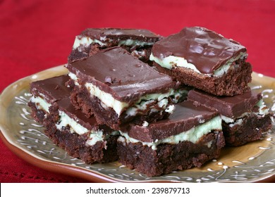 Mint Chocolate Brownies On Plate With Red Tablecloth 