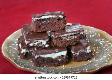 Mint Chocolate Brownies On Plate With Red Tablecloth 