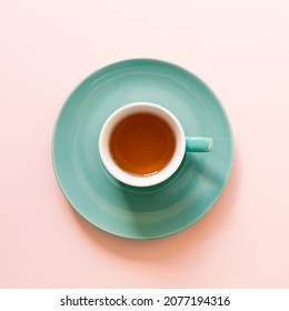 Mint Color Tea Cup Isolated On Pink Background. Top View