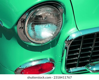 Mint green car abstract of front head light, turn signal and grill  - Powered by Shutterstock