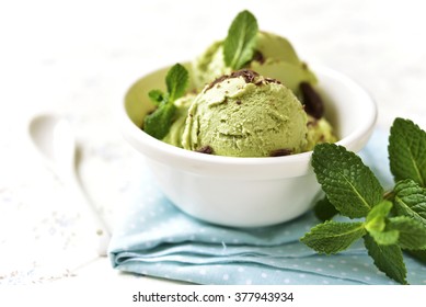 Mint Ice Cream With Chocolate Chips In A Bowl On A Light Background.