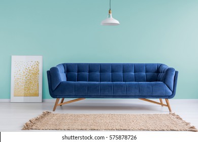 Mint Living Room With Blue Sofa, Rug And Lamp