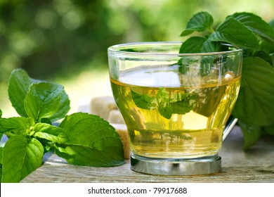 Mint tea with fresh mint leaves and sugar cubes - Powered by Shutterstock