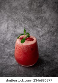 Mint-Infused Strawberry Elixir Surrounded by Frozen Berry Bliss