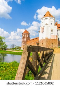 Mir, Belarus. Castle Complex Mir On Sunny Day with blue sky Background. Old medieval Towers and walls of traditional fort from unesco world heritage list