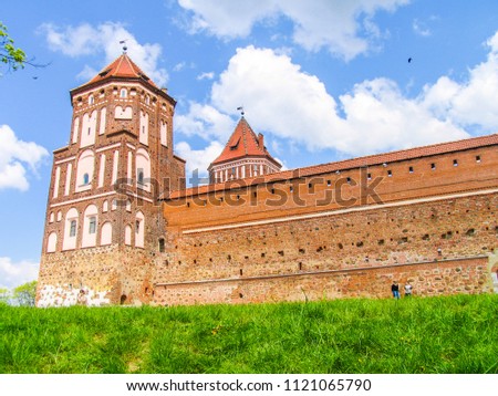 Mir, Belarus. Castle Complex Mir On Sunny Day with blue sky Background. Old medieval Towers and walls of traditional fort from unesco world heritage list