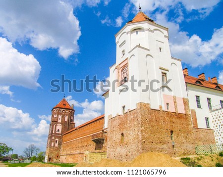 Mir, Belarus. Castle Complex Mir On Sunny Day with blue sky Background. Old medieval Towers and walls of traditional fort from unesco world heritage list