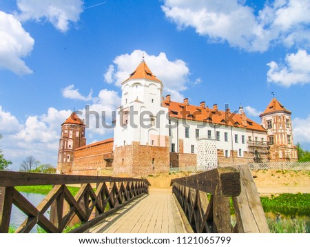 Mir, Belarus. Castle Complex Mir On Sunny Day with blue sky Background. Old medieval Towers and walls of traditional fort from unesco world heritage list