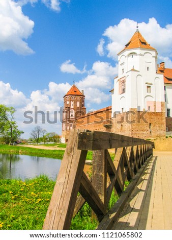 Mir, Belarus. Castle Complex Mir On Sunny Day with blue sky Background. Old medieval Towers and walls of traditional fort from unesco world heritage list