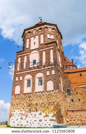 Mir, Belarus. Castle Complex Mir On Sunny Day with blue sky Background. Old medieval Towers and walls of traditional fort from unesco world heritage list