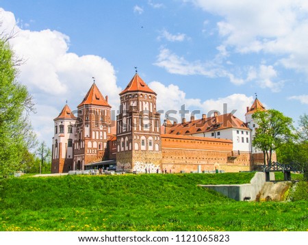 Mir, Belarus. Castle Complex Mir On Sunny Day with blue sky Background. Old medieval Towers and walls of traditional fort from unesco world heritage list