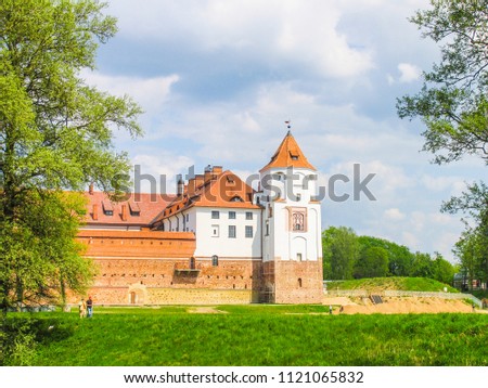 Mir, Belarus. Castle Complex Mir On Sunny Day with blue sky Background. Old medieval Towers and walls of traditional fort from unesco world heritage list