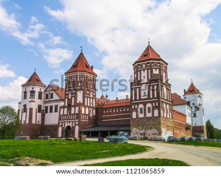 Mir, Belarus. Castle Complex Mir On Sunny Day with blue sky Background. Old medieval Towers and walls of traditional fort from unesco world heritage list