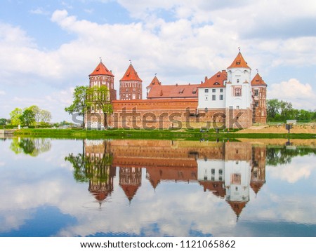 Mir, Belarus. Castle Complex Mir On Sunny Day with blue sky Background. Old medieval Towers and walls of traditional fort from unesco world heritage list