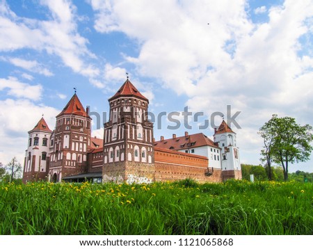 Mir, Belarus. Castle Complex Mir On Sunny Day with blue sky Background. Old medieval Towers and walls of traditional fort from unesco world heritage list